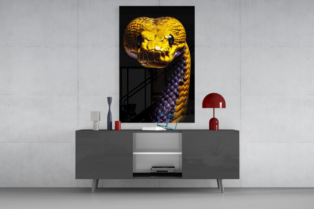 Golden Headed Snake glass wall art catching light to reveal its scale gleam