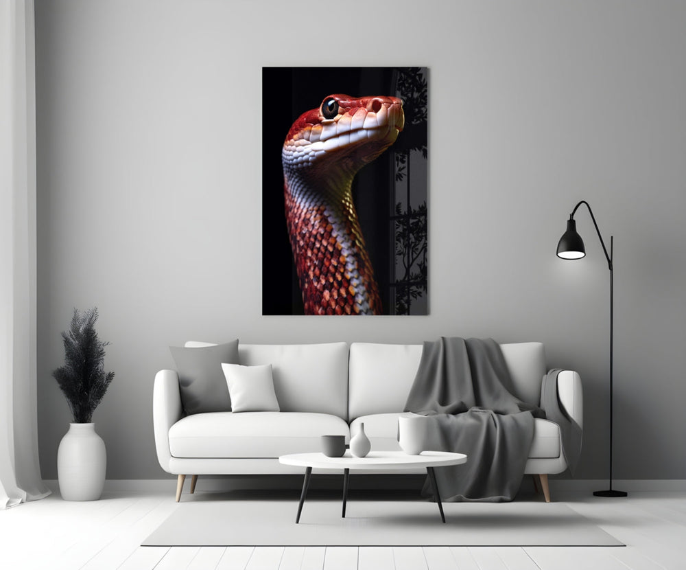 Close-up detail of the coral-red snake and amber eye behind glass