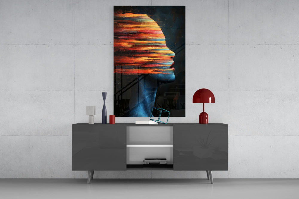 The Face of Colors glass wall art catching light to reveal its painted strokes