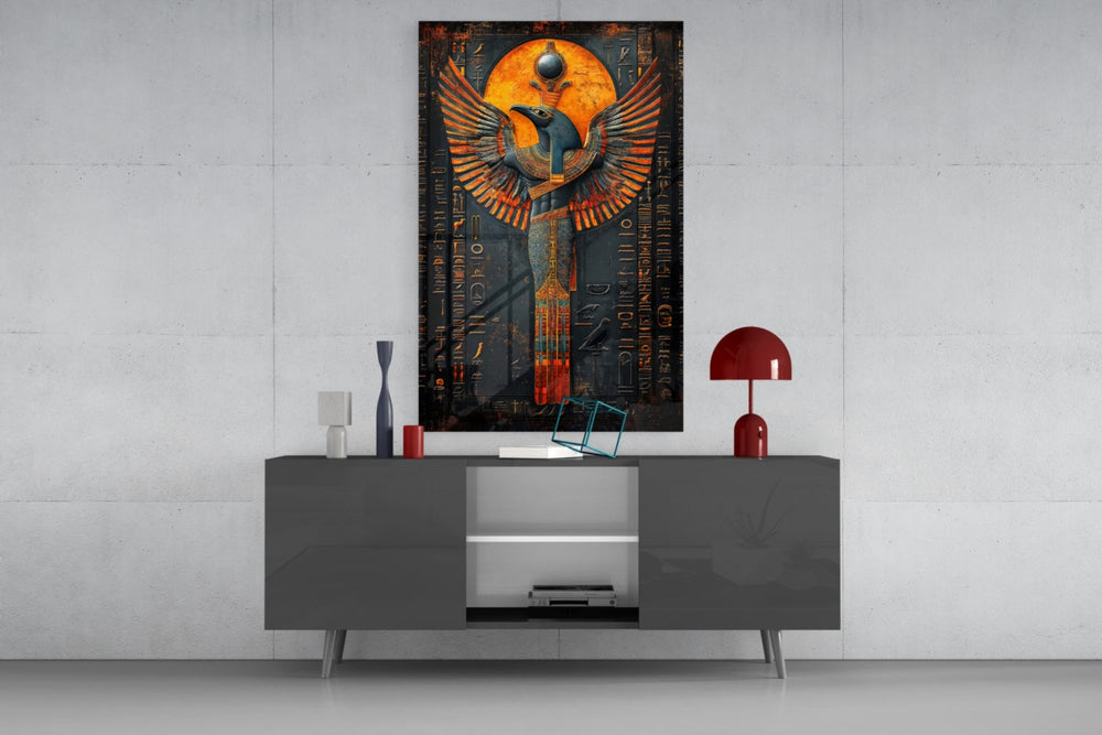 Winged God glass wall art catching light to reveal its painted gold-leaf