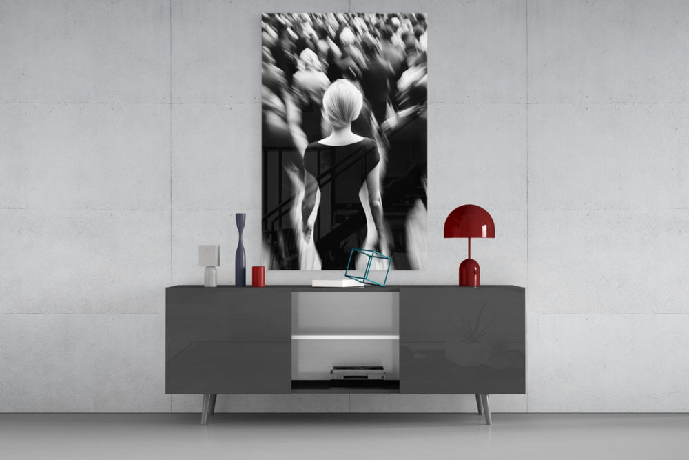 Loneliness in a Crowd glass wall art catching light to reveal its painted blur