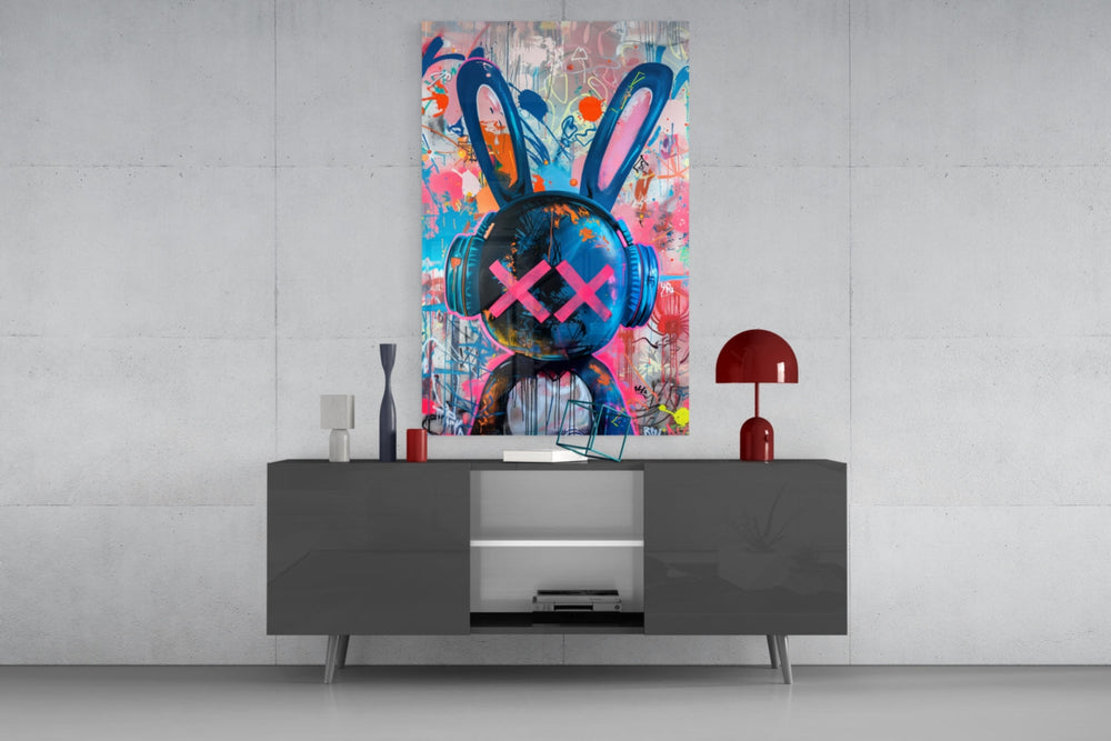 Graffiti Rabbit glass wall art catching light to reveal its layered tags