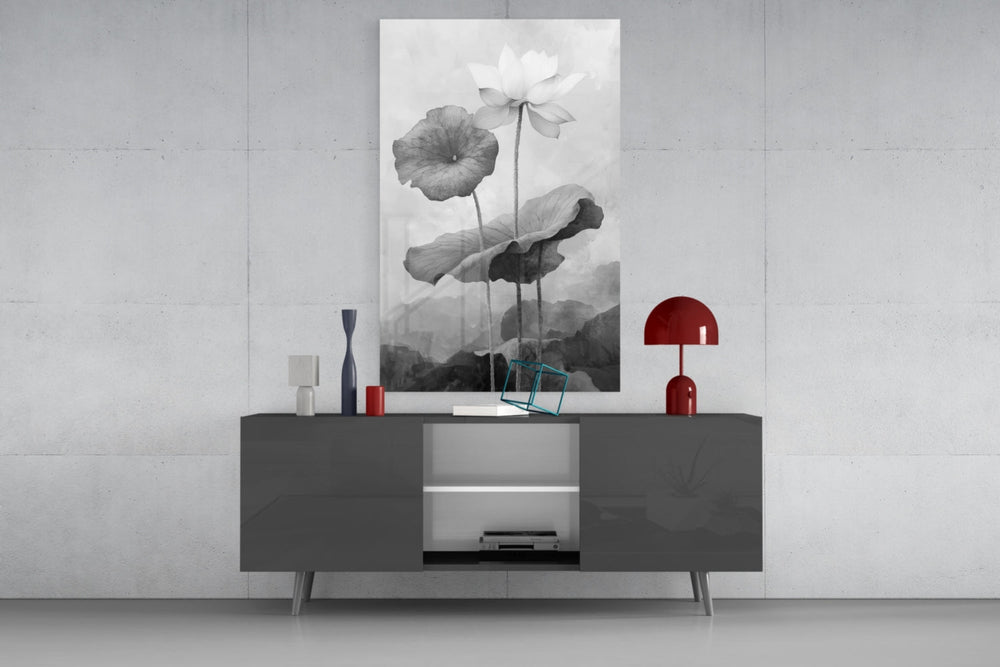 Black and White Water Lily glass wall art catching light to reveal its painted petals