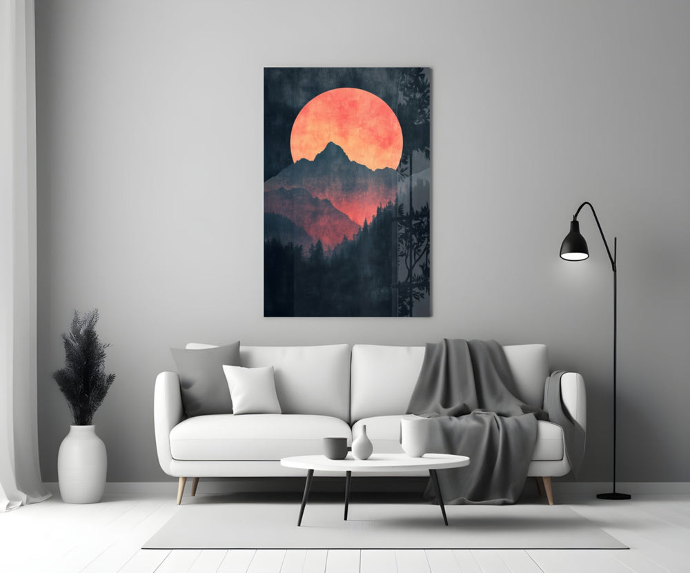 Close-up detail of red-orange moon over peaks behind glass