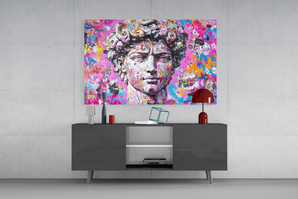 Graffiti David glass wall art catching light to reveal its layered tags