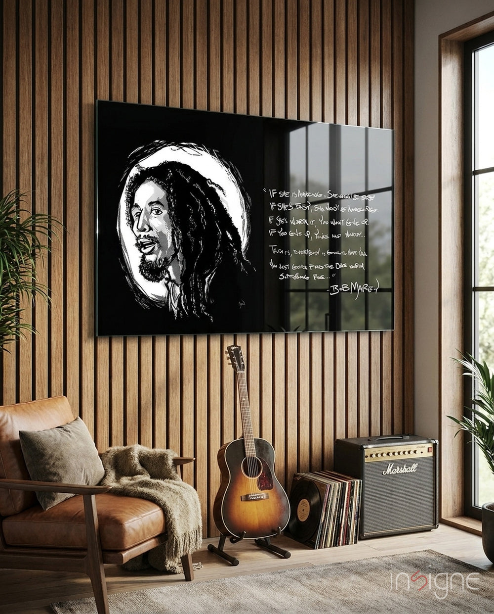 Words of Bob Marley glass wall art in a modern music studio