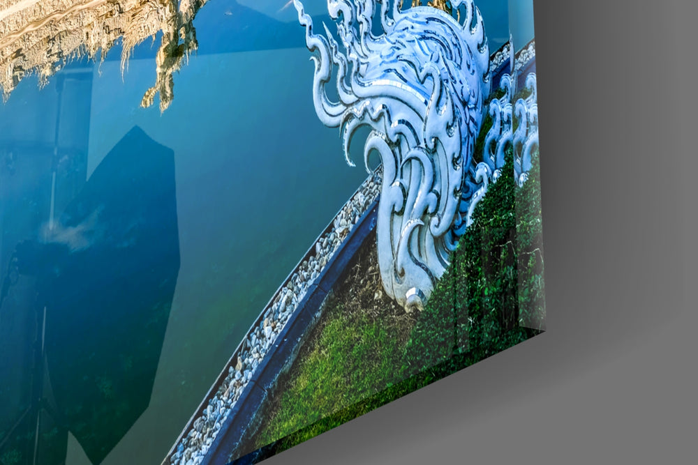 Cinematic temple cobalt-sky reflection glass wall art in serene meditation corner