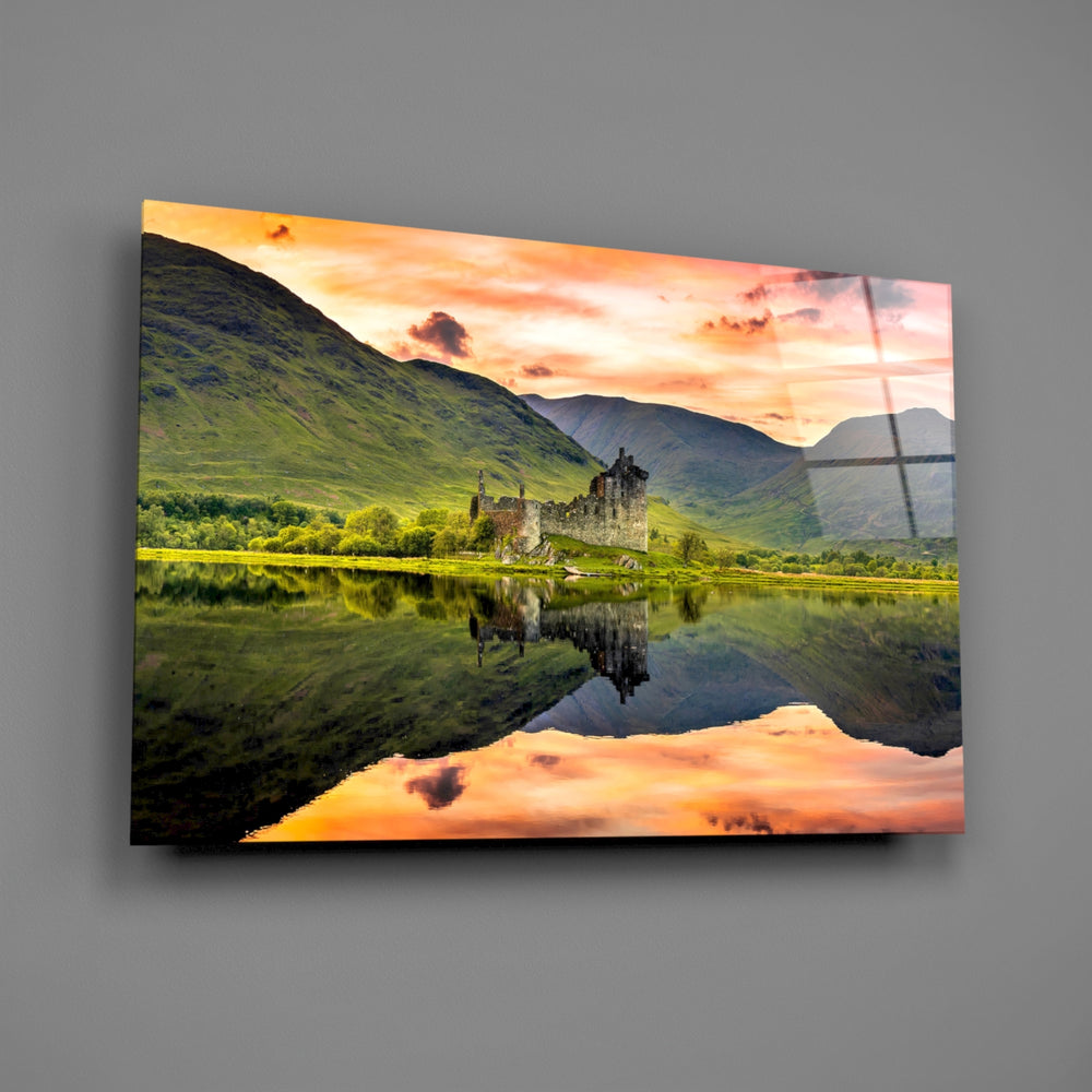 Scottish loch ruin sunset glass wall art over walnut console with single-malt decanter
