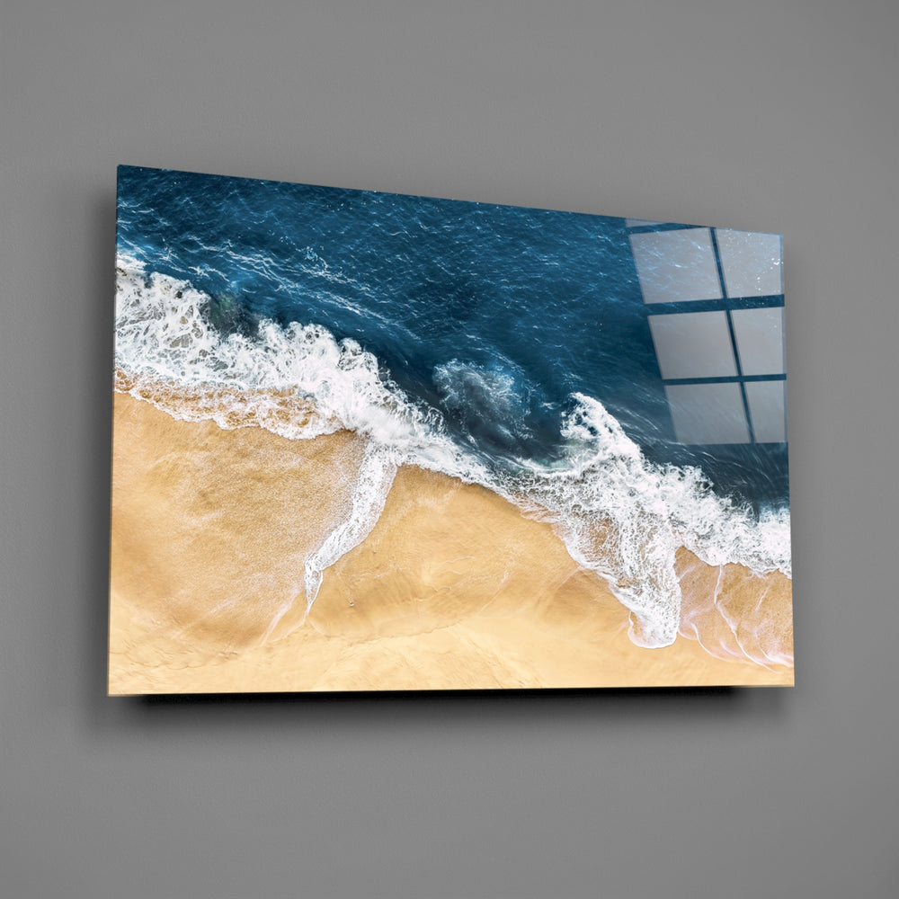Top-down indigo surf cinematic glass wall art in spa bathroom over freestanding tub