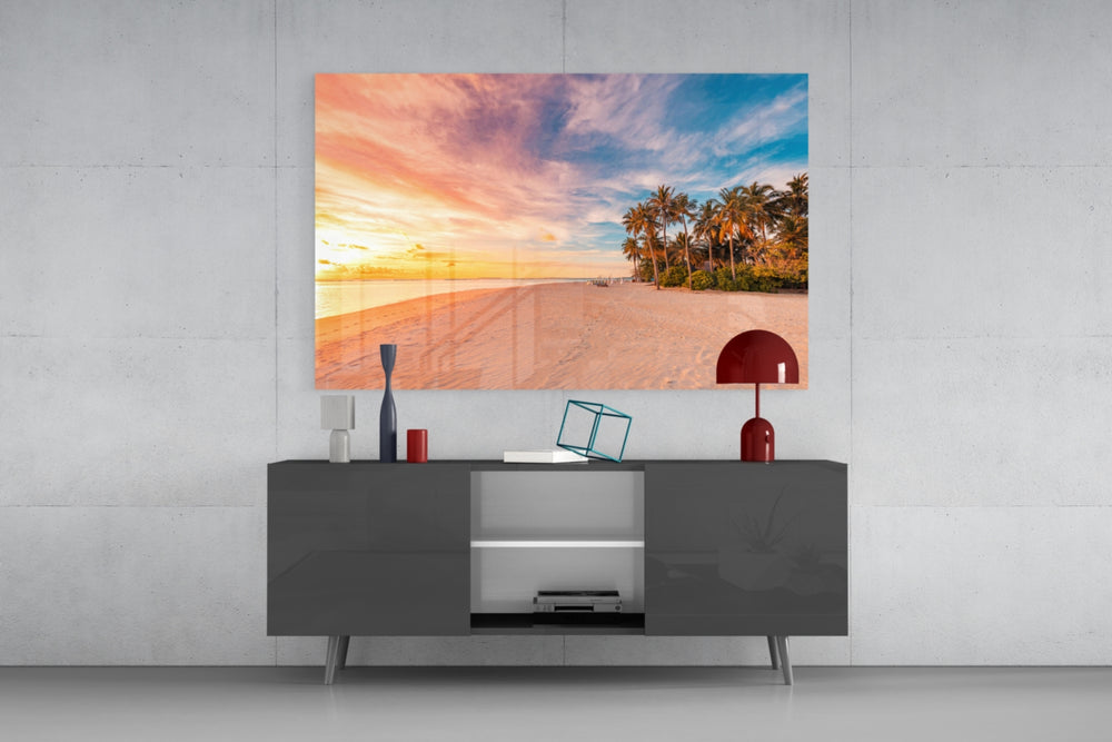 Palm-fringed sunset shoreline glass wall art in guest-bedroom alcove