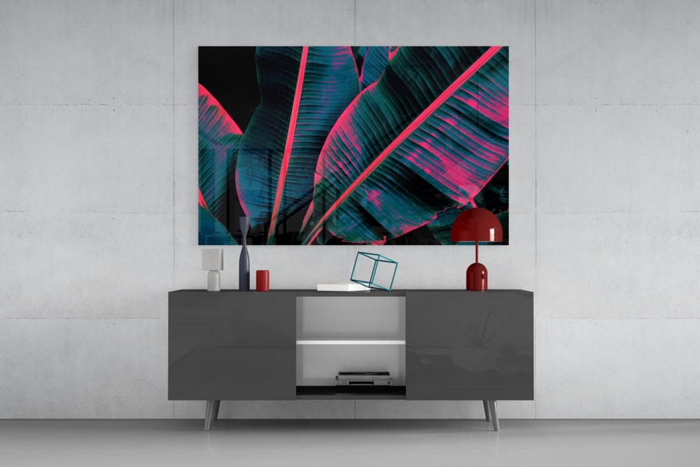 Stage-lit tropical leaf glass wall art in nightclub-style home bar