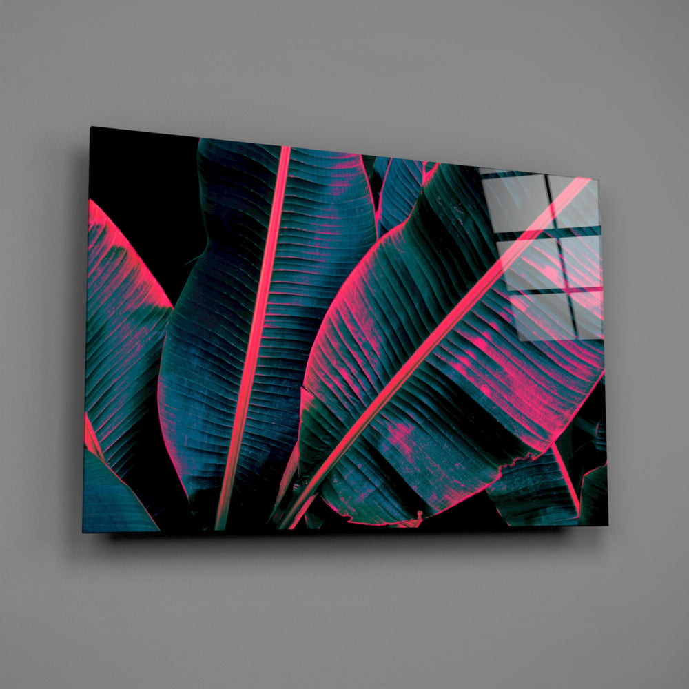 Teal-and-pink tropical foliage glass wall art over modern living-room sofa