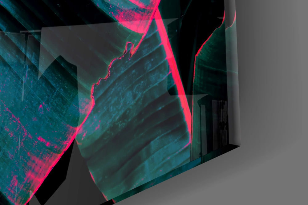 Synthwave banana-frond glass wall art in dramatic dining room with brass fixtures