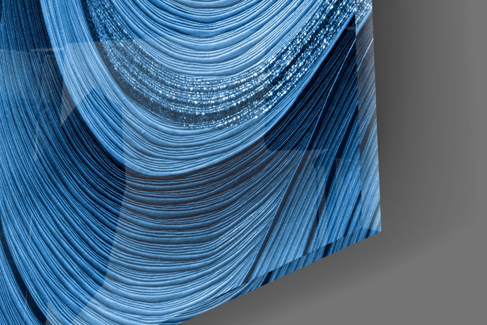 Cinematic indigo wave-band glass wall art in wellness studio reception