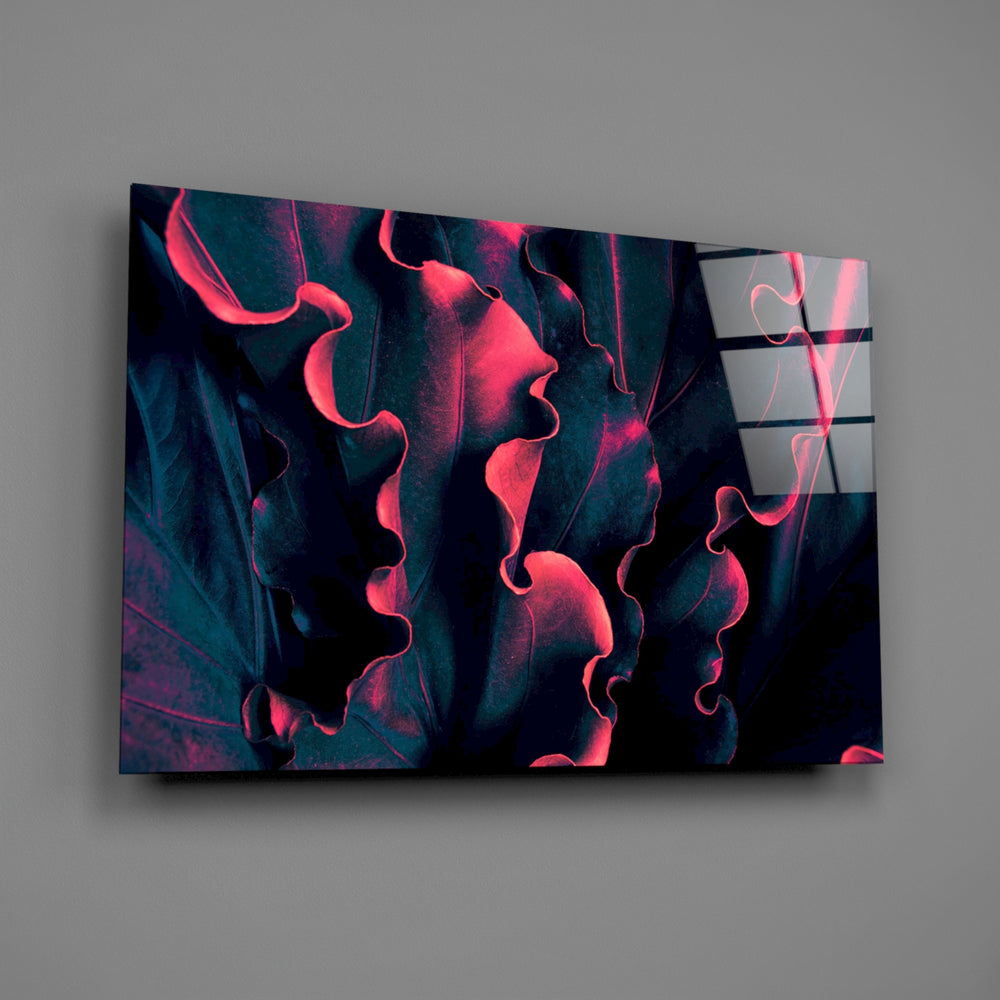 Teal-and-coral alocasia foliage glass wall art over modern living-room sofa