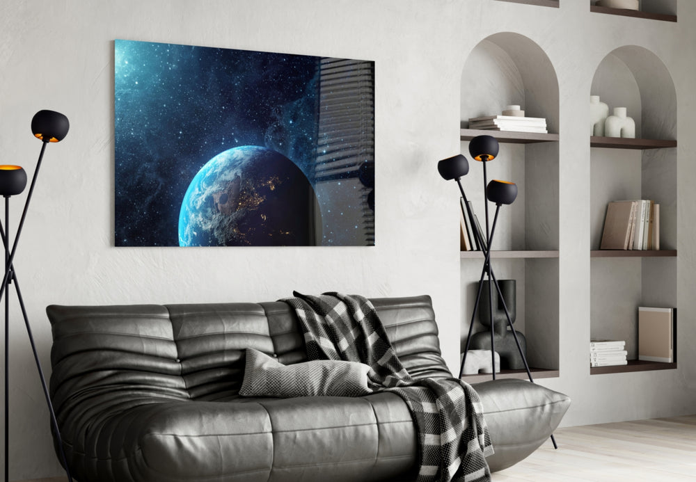 Earth-from-orbit cinematic glass wall art over modern dining sideboard