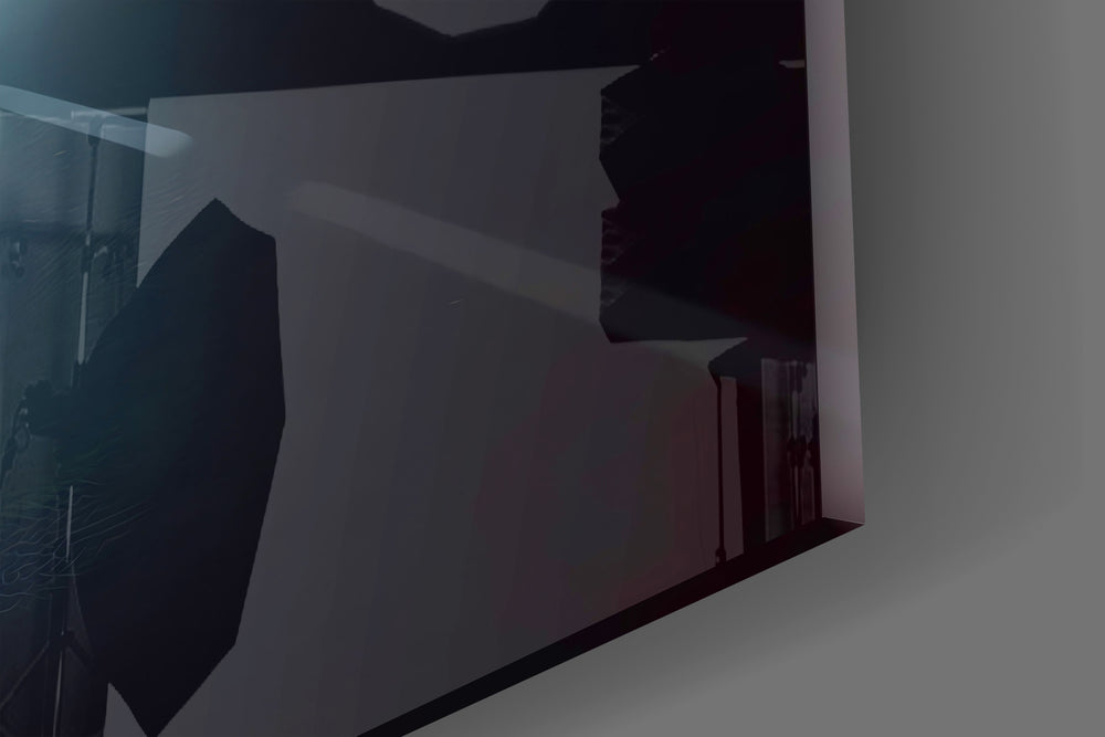 Streetlight-and-figure cinematic glass wall art in boutique-hotel suite