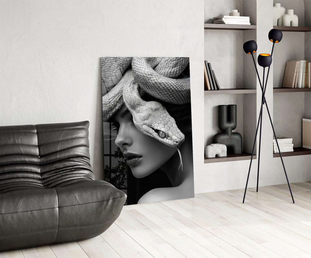 B&W muse-with-snake cinematic glass wall art over modern dining sideboard