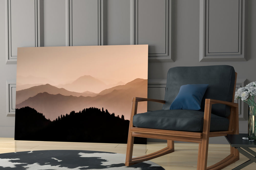 Mountains artwork anchoring a wall with serene warm palette