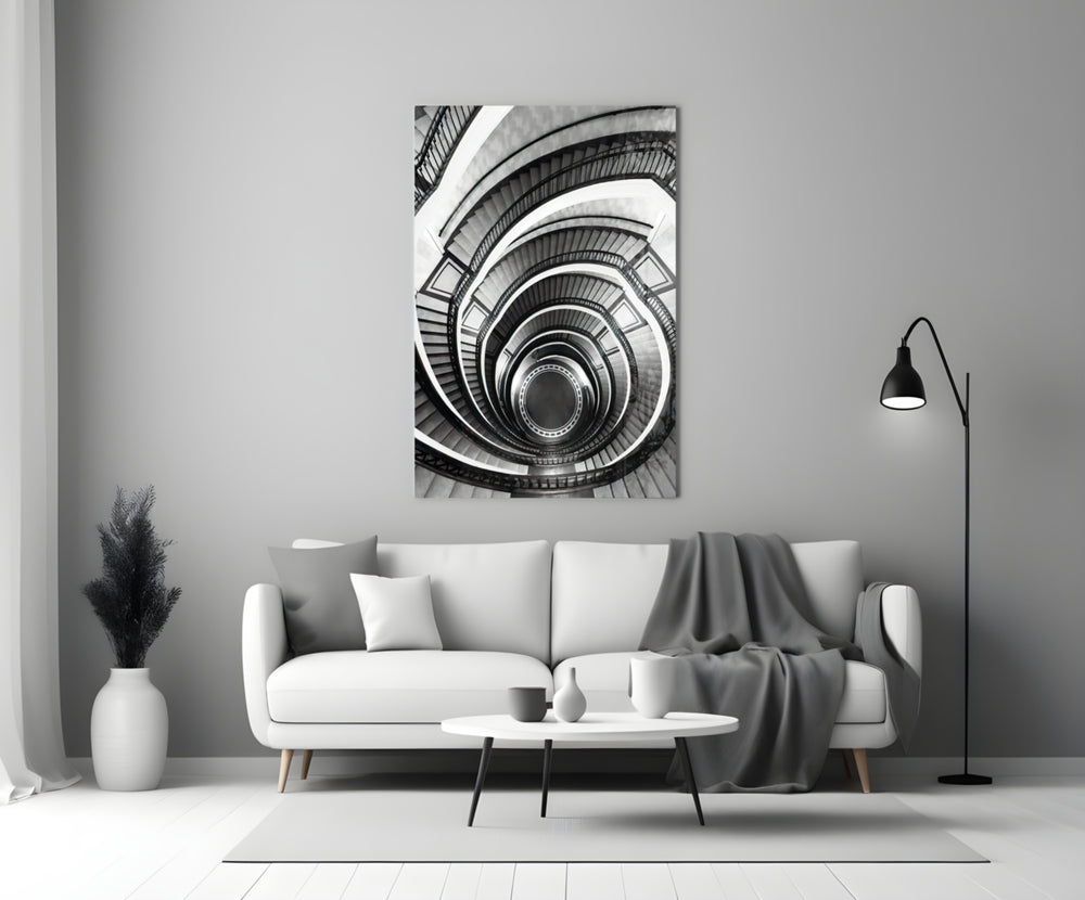 Loop glass wall art styled above a bench in a stairwell