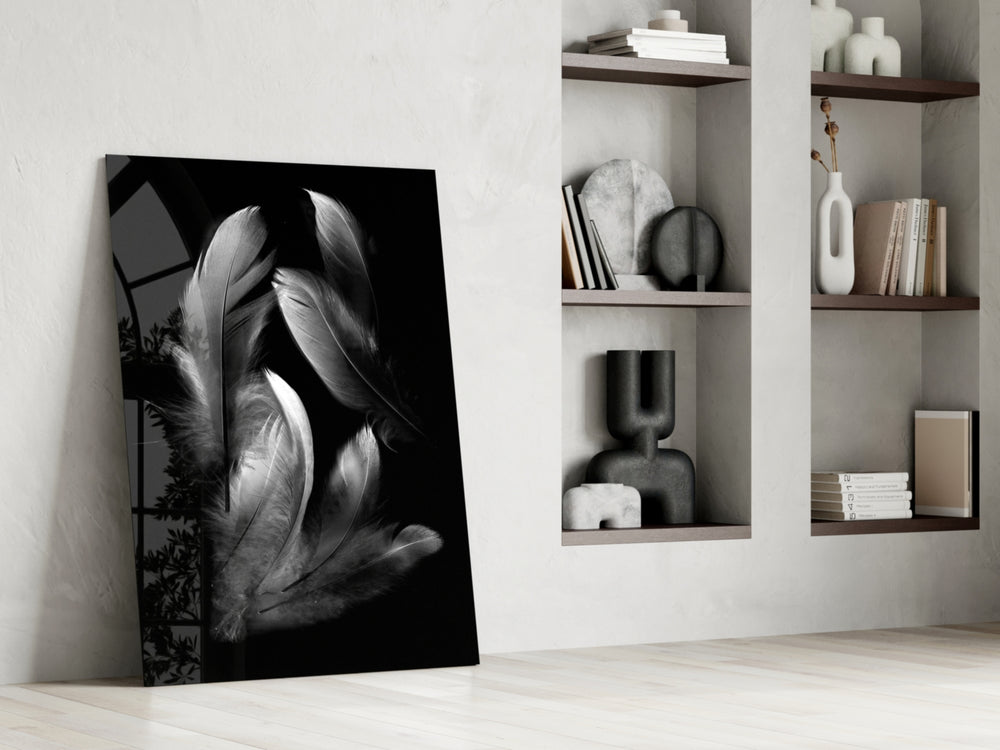Feather artwork anchoring a wall with moody serene palette
