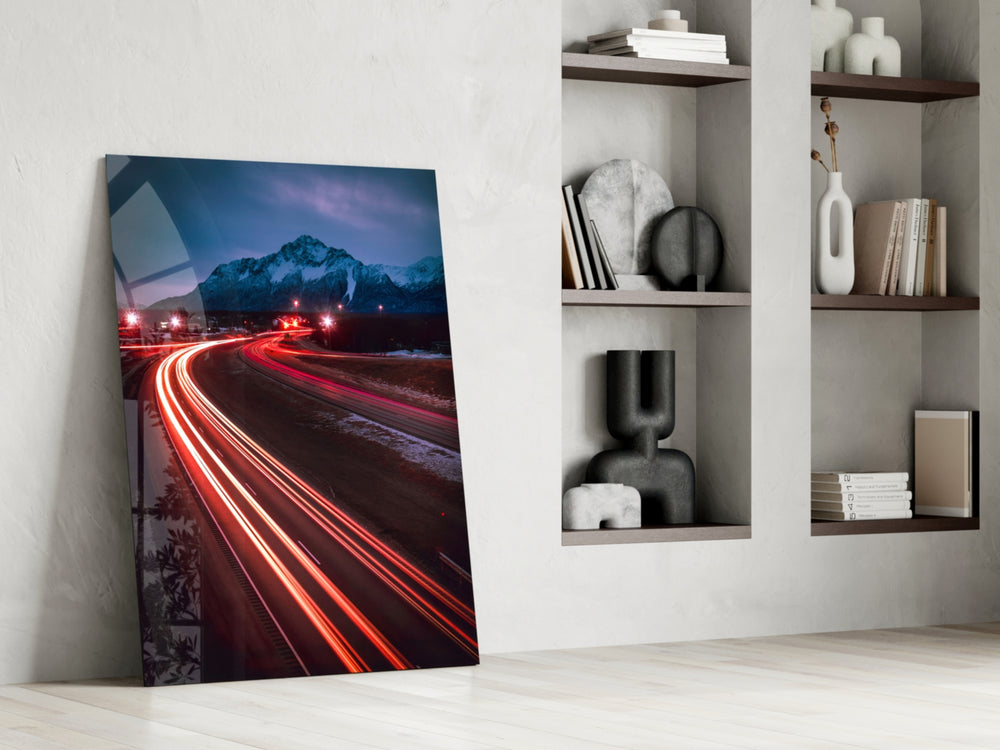 Road artwork anchoring a wall with bold kinetic palette