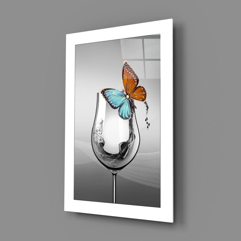 Close-up detail of teal-amber butterfly on wine glass rim