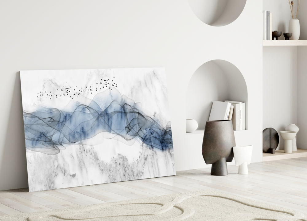 Ink Drift glass wall art styled above a console in a modern foyer