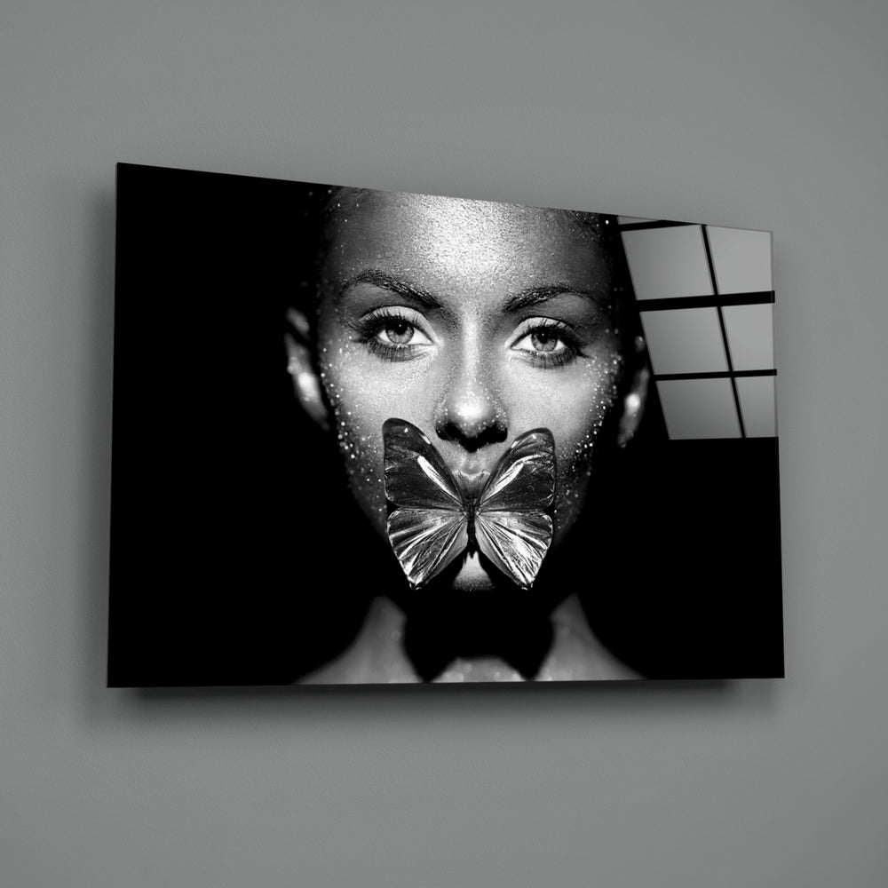 Close-up detail of butterfly settled across closed lips