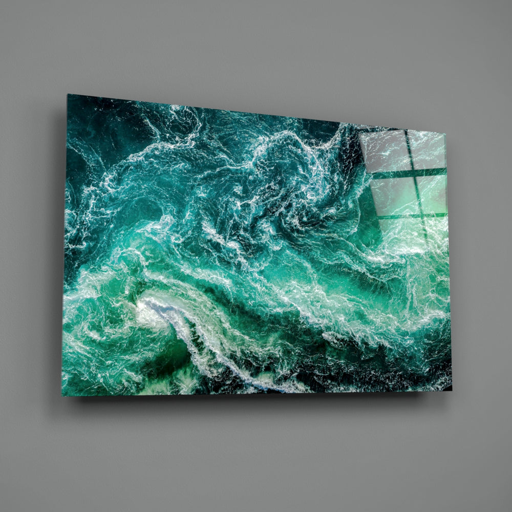 Close-up detail of emerald foam swirling against cyan currents