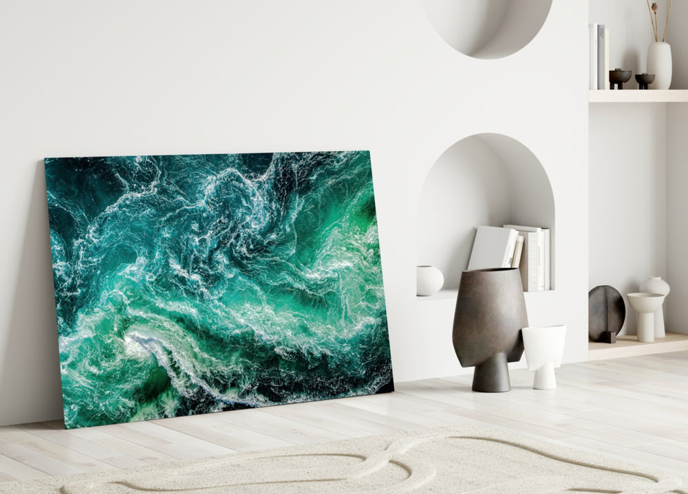 Ocean glass wall art styled above a sofa in a living room