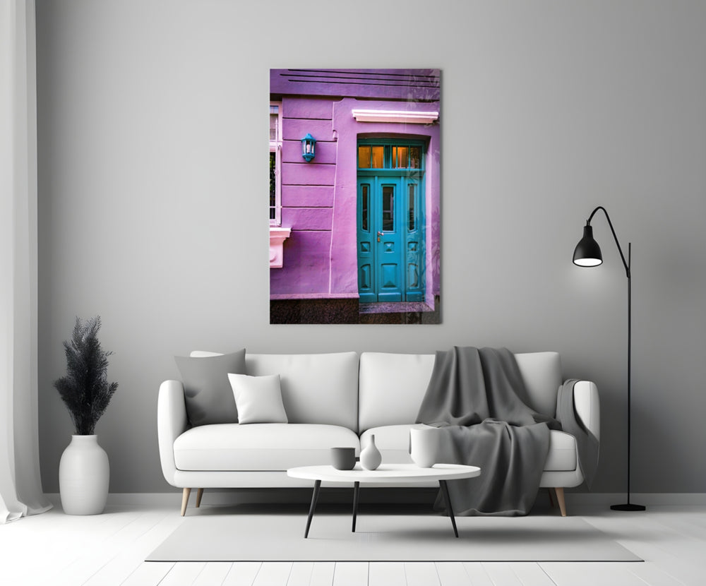 Blue Door glass wall art styled above a sideboard in a sunroom