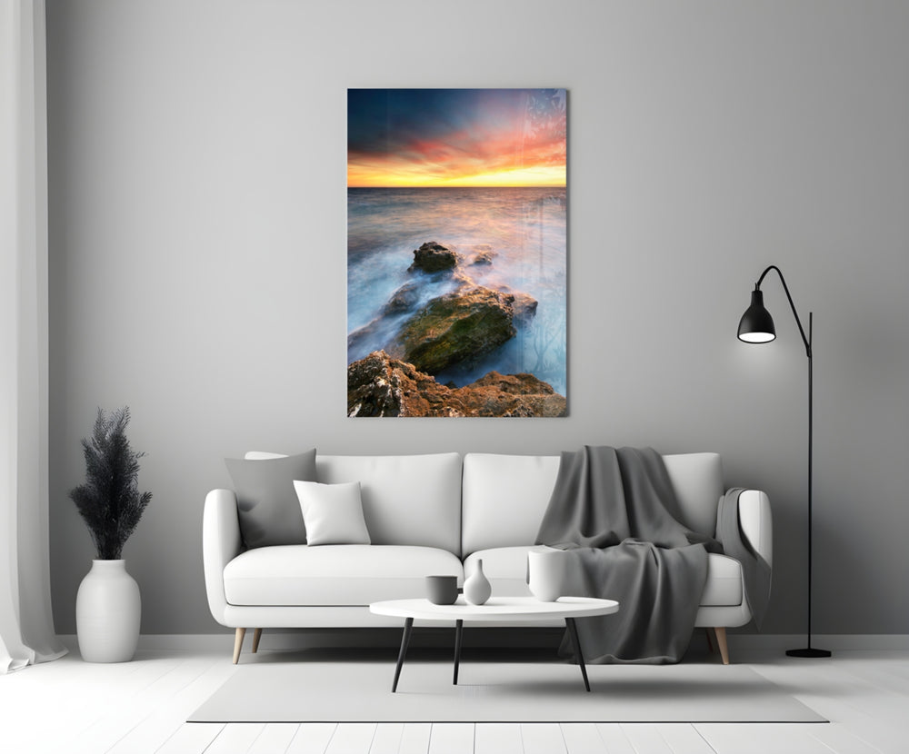 Coast Sunset glass wall art styled above a sofa in a living room