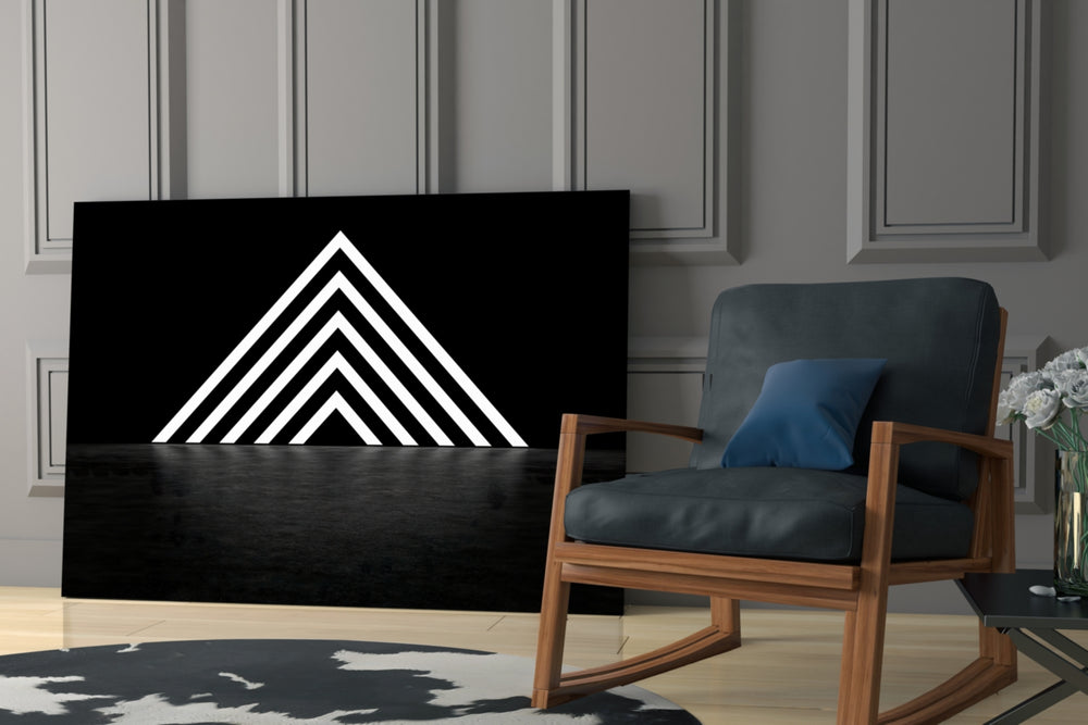 Triangle artwork anchoring a wall with moody modern palette