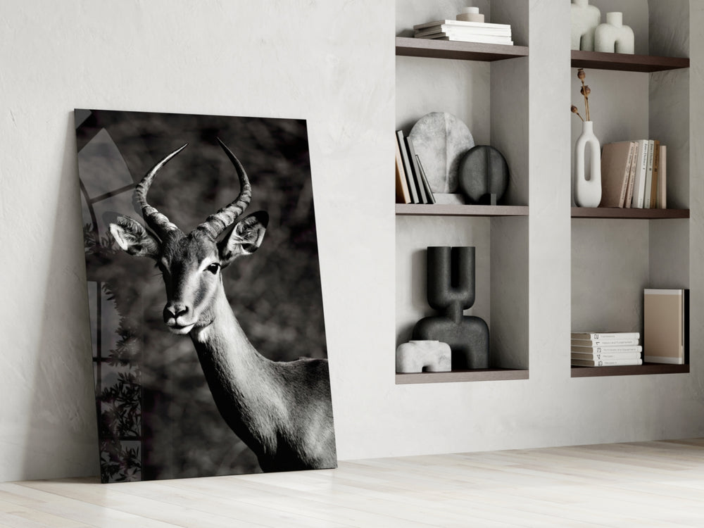 Impala artwork anchoring a wall with moody naturalist palette