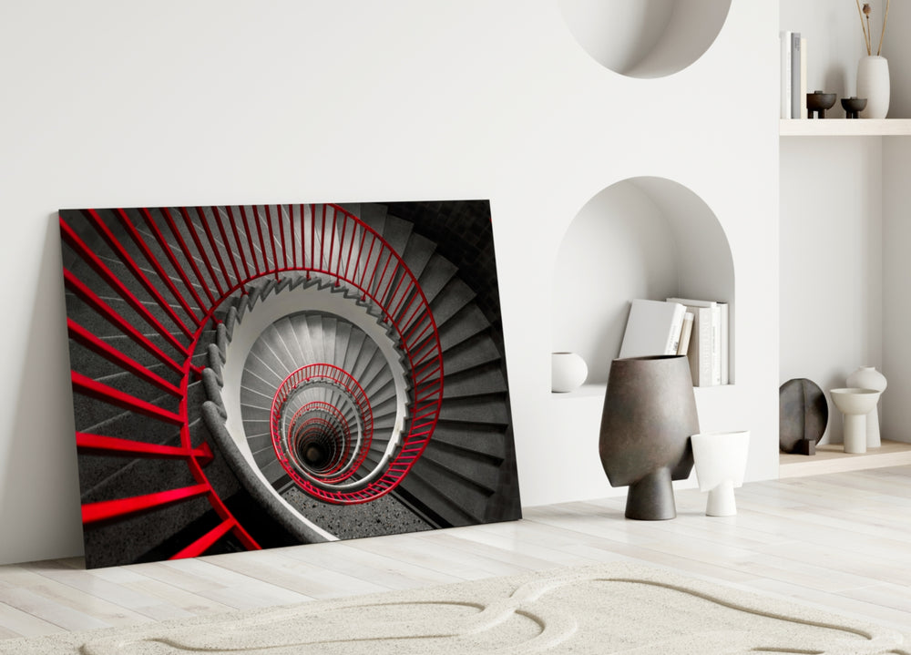 Red Spiral glass wall art styled above a console in a foyer