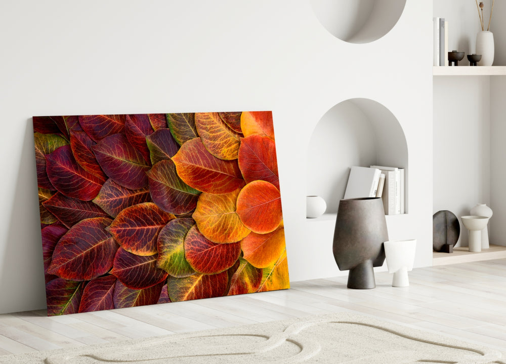 Autumn Leaves glass wall art styled above a sofa in a living room