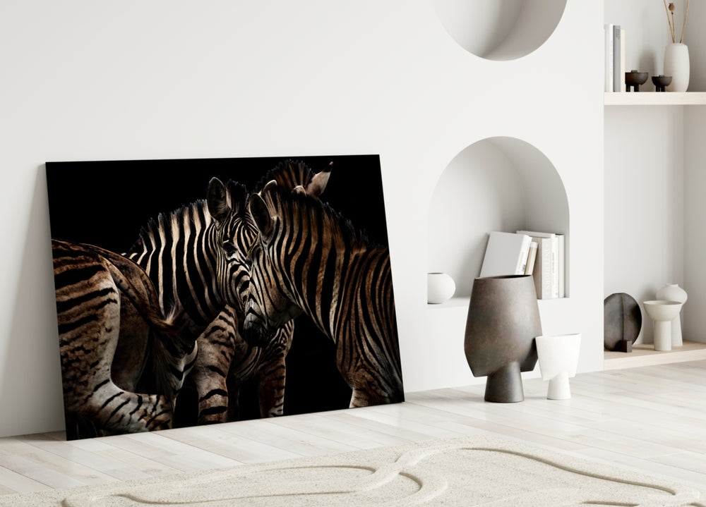 Zebras glass wall art styled above a sideboard in a man's office