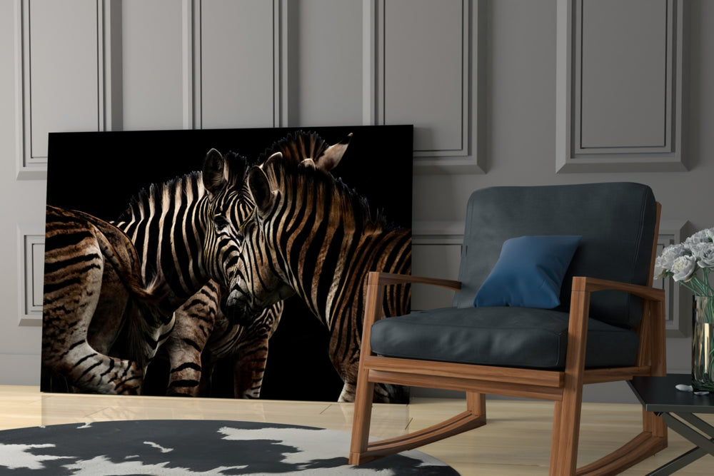 Zebras artwork anchoring a wall with moody naturalist palette