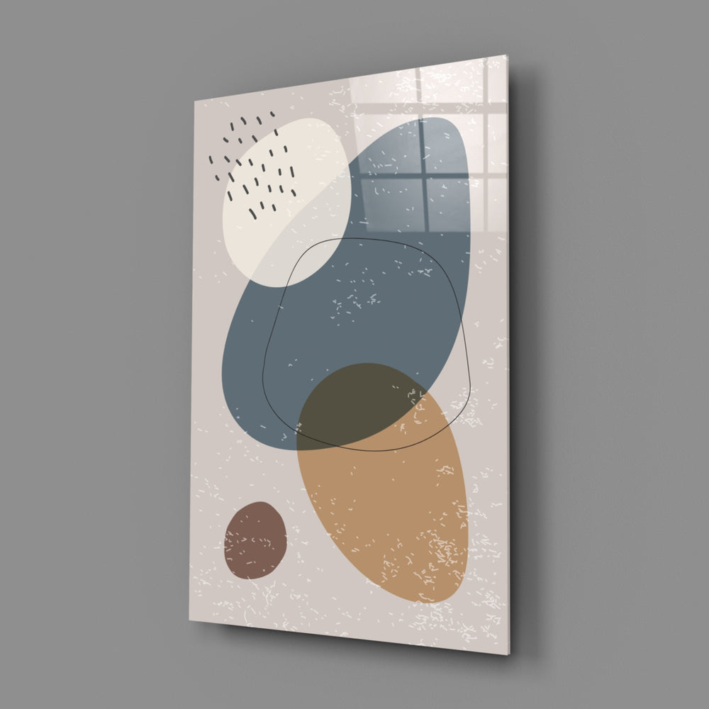 Close-up detail of navy and ochre pebbles against textured ivory paper