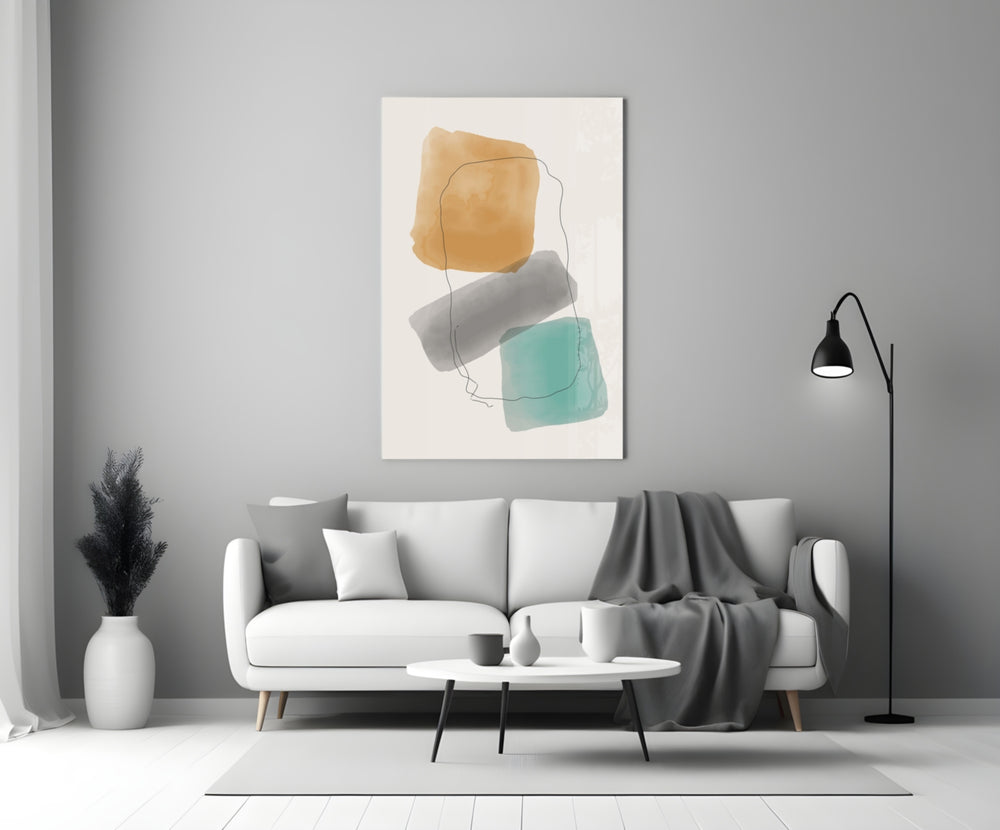 Soft Trio glass wall art styled above a sofa in a living room