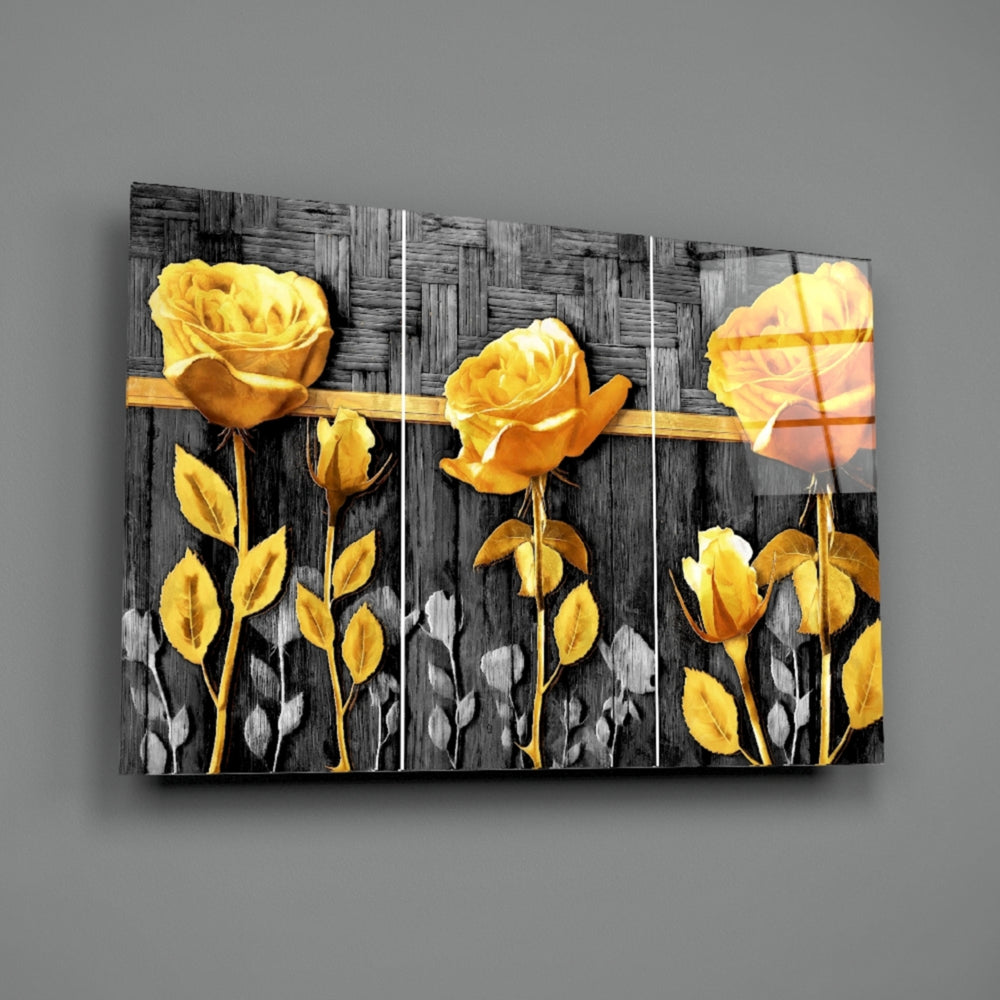 Close-up detail of gold-yellow rose against grey wood