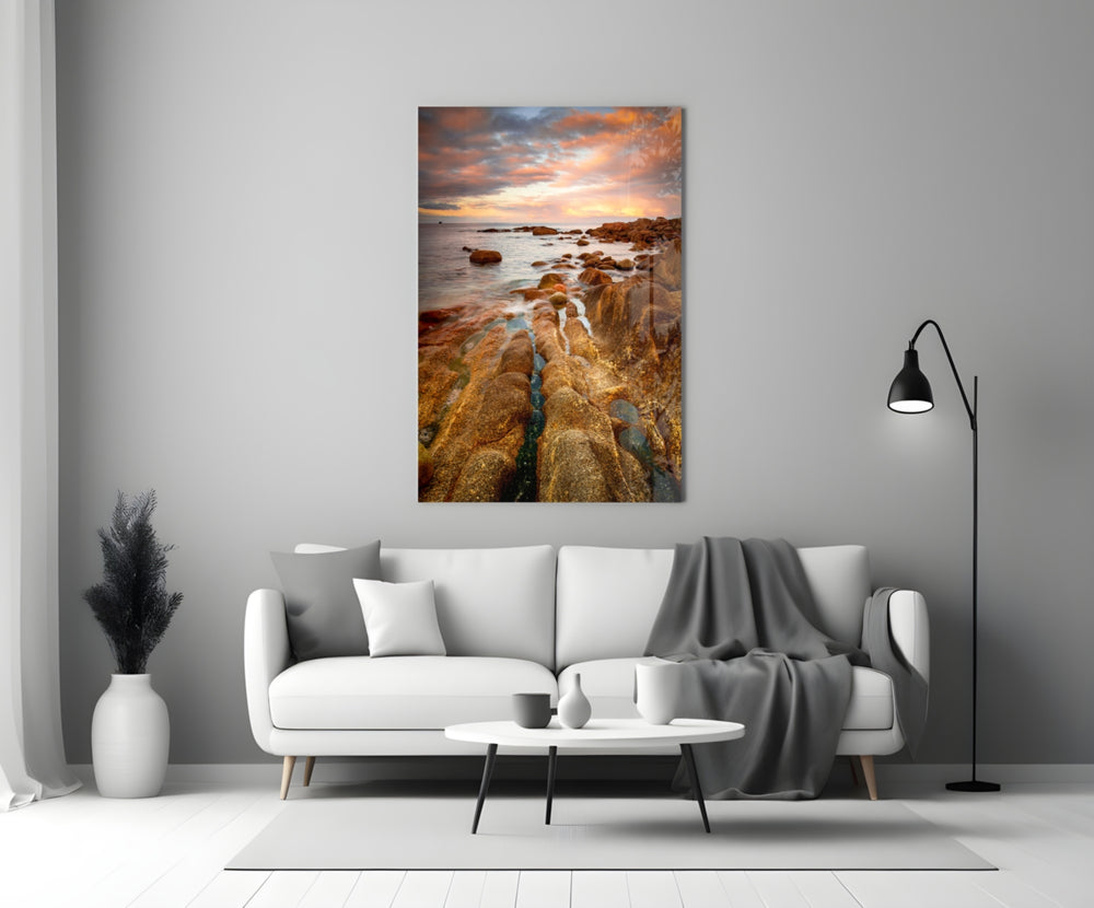 Golden Coast glass wall art styled above a sofa in a living room