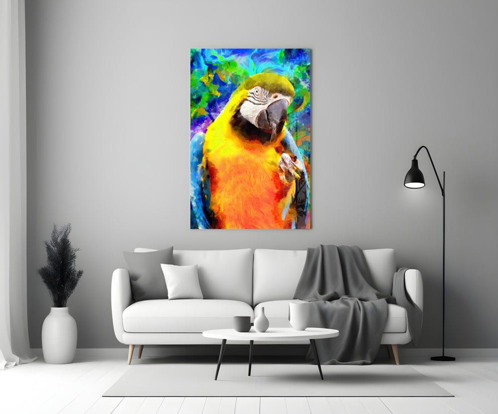 Macaw Bloom glass wall art styled above a sofa in a living room