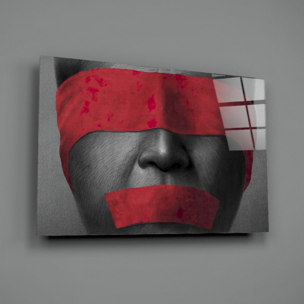Silenced close-up showing crimson blindfold against monochrome face