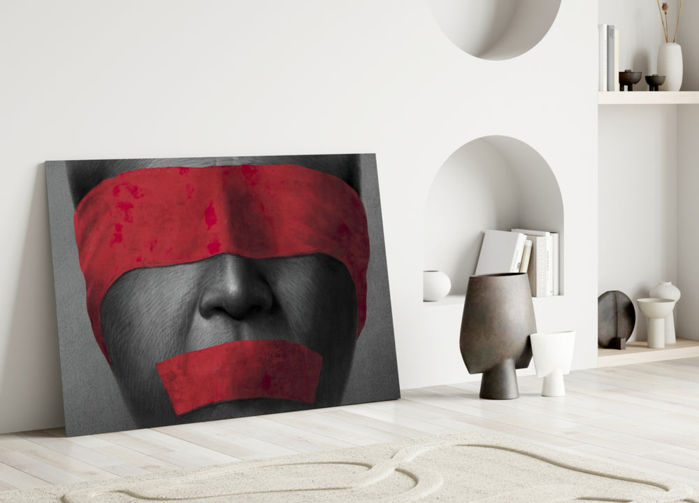 Silenced glass wall art styled above a credenza in a creative office