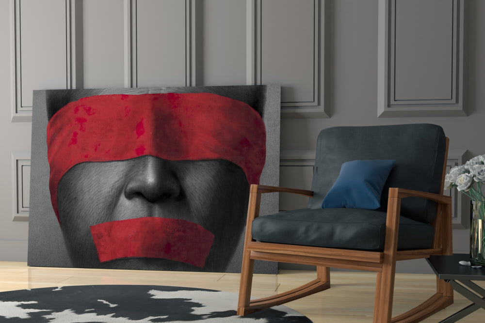Silenced artwork anchoring a wall with bold conceptual palette