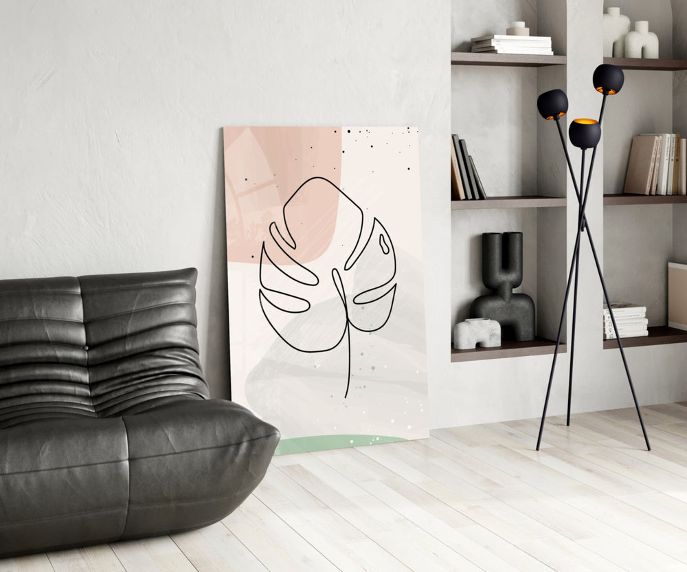 Line Monstera glass print enhancing a bedroom with editorial drama