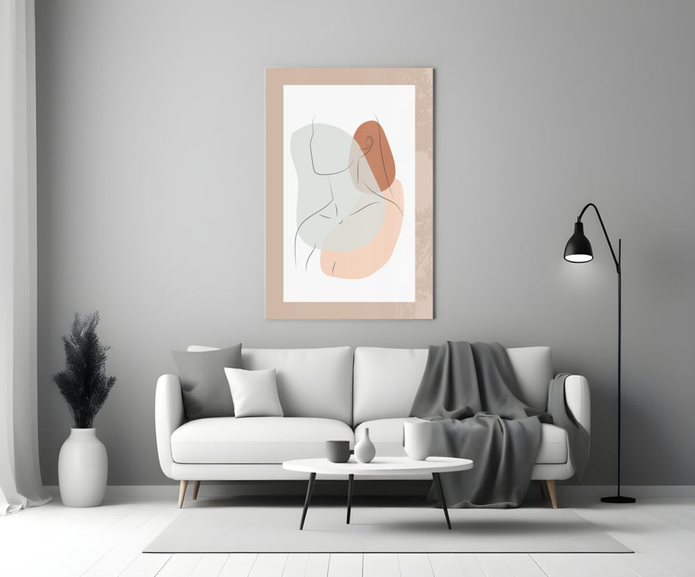 Seated Line glass wall art styled above a sofa in a master bedroom