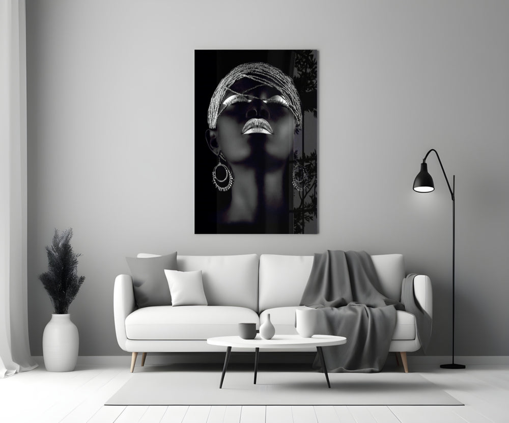 Silver Crown glass wall art styled above a sofa in a master bedroom